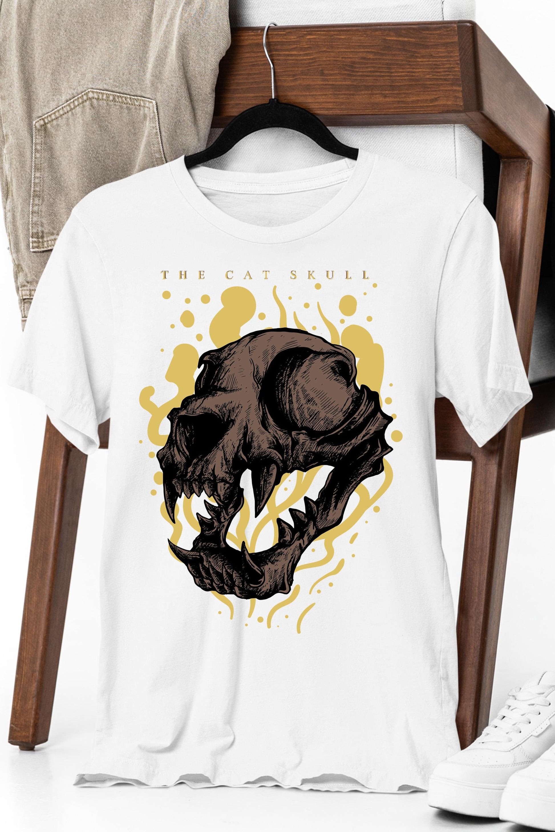 a white t - shirt with a picture of a dinosaur on it