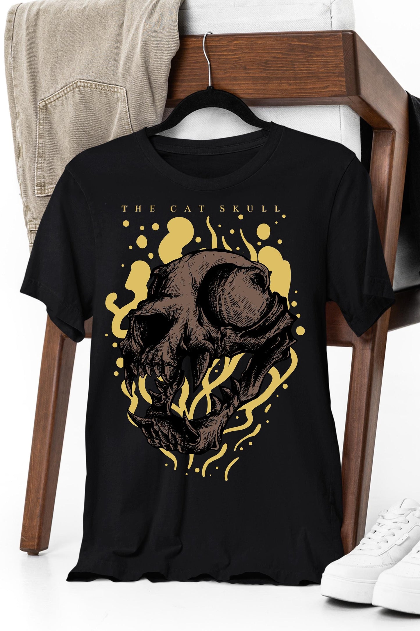 a black t - shirt with a picture of a bear on it