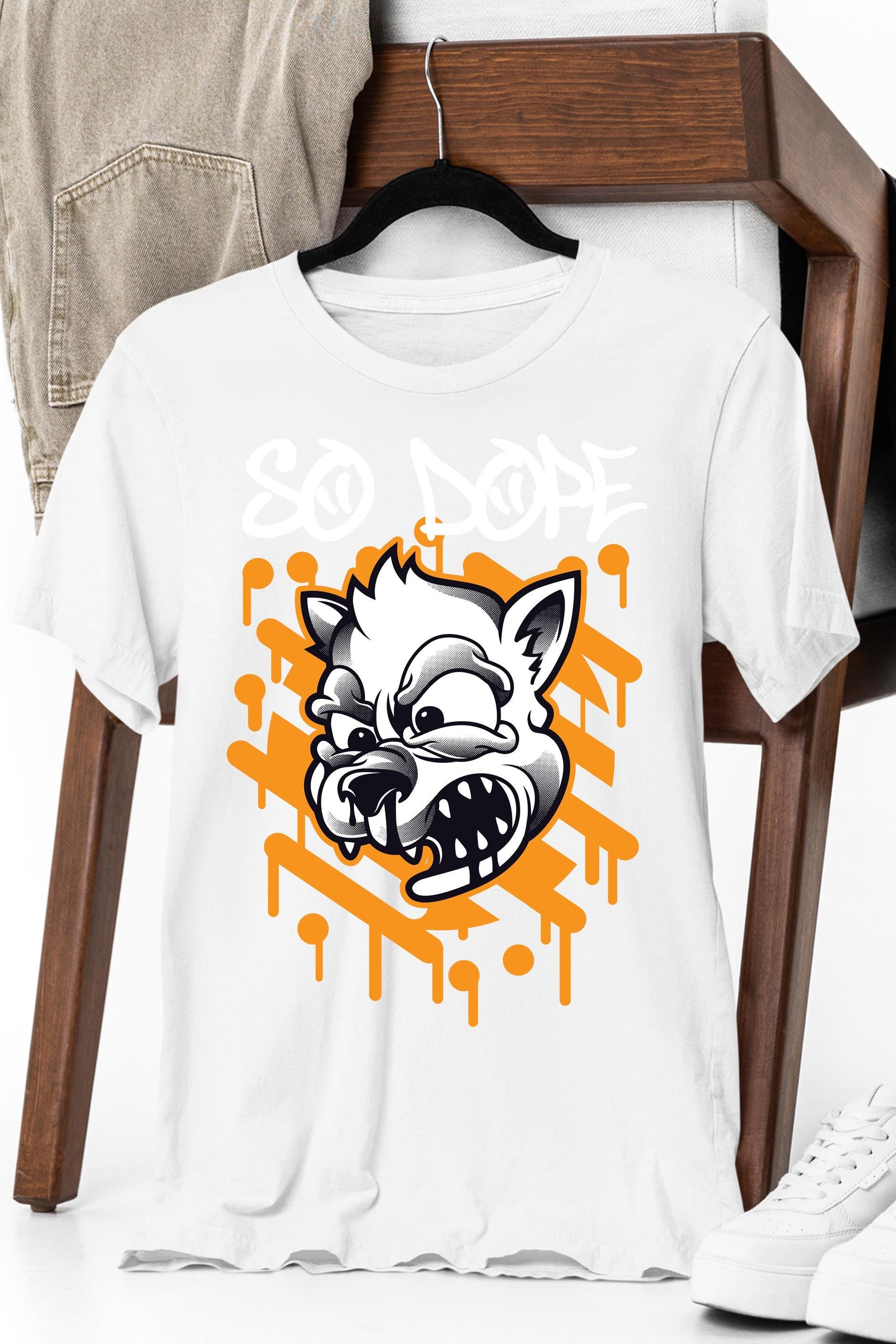 a white t - shirt with an image of a cat on it