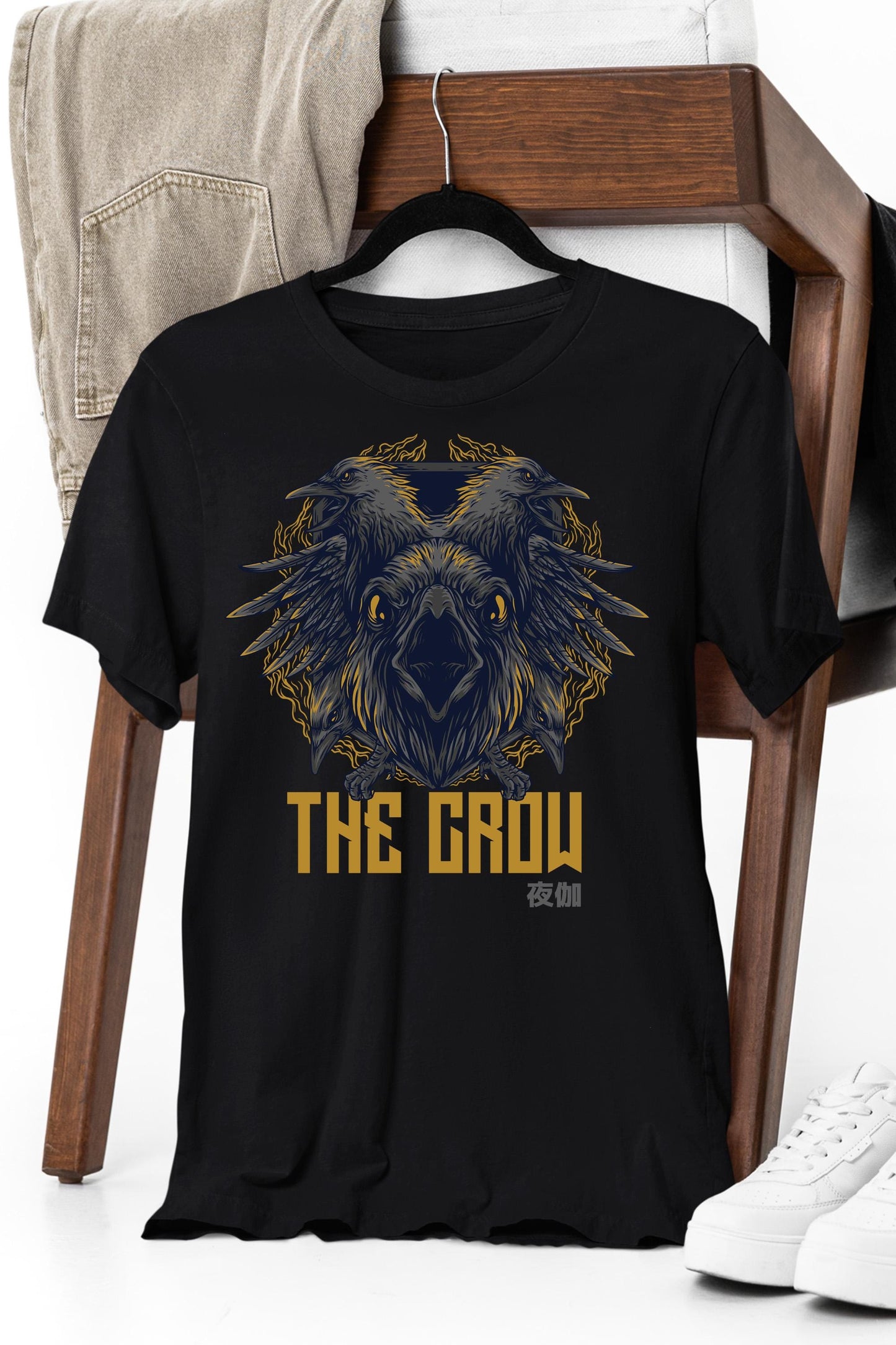 a black t - shirt with a picture of an owl on it
