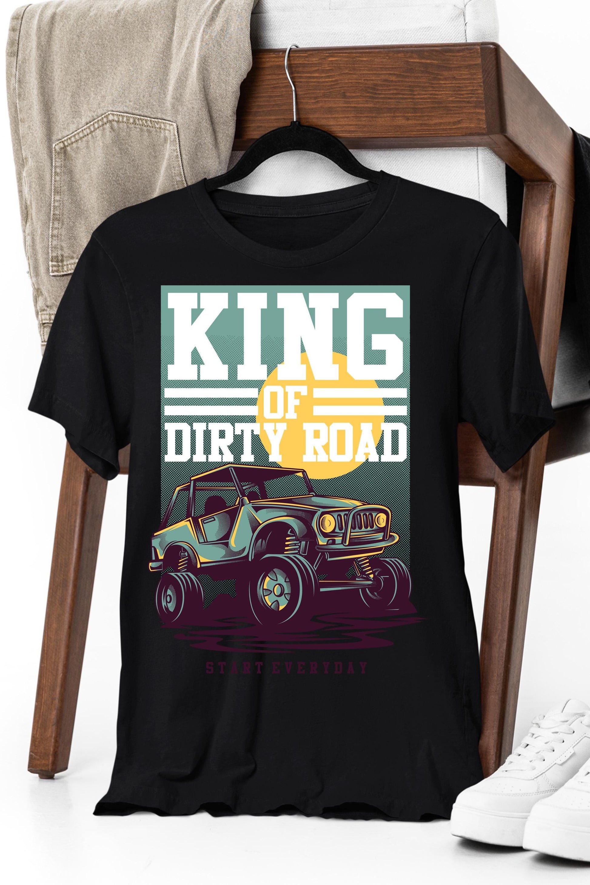 a black t - shirt with a picture of a truck on it